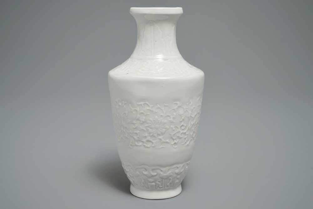 A Chinese relief-decorated blanc de Chine vase, 19/20th C.